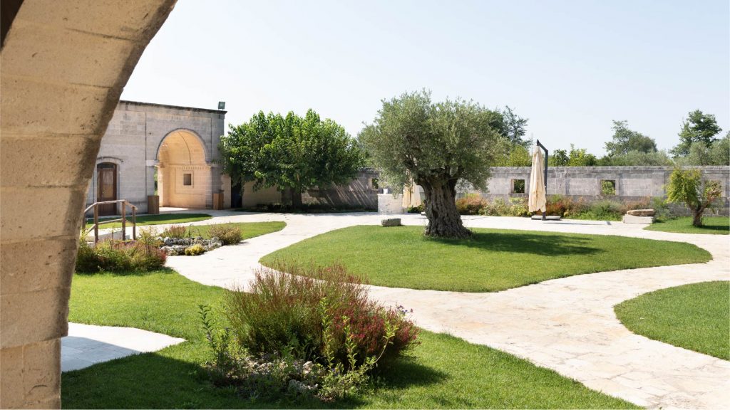A serene garden view at Tenuta Viglione, surrounded by nature and vineyards in the heart of Puglia.