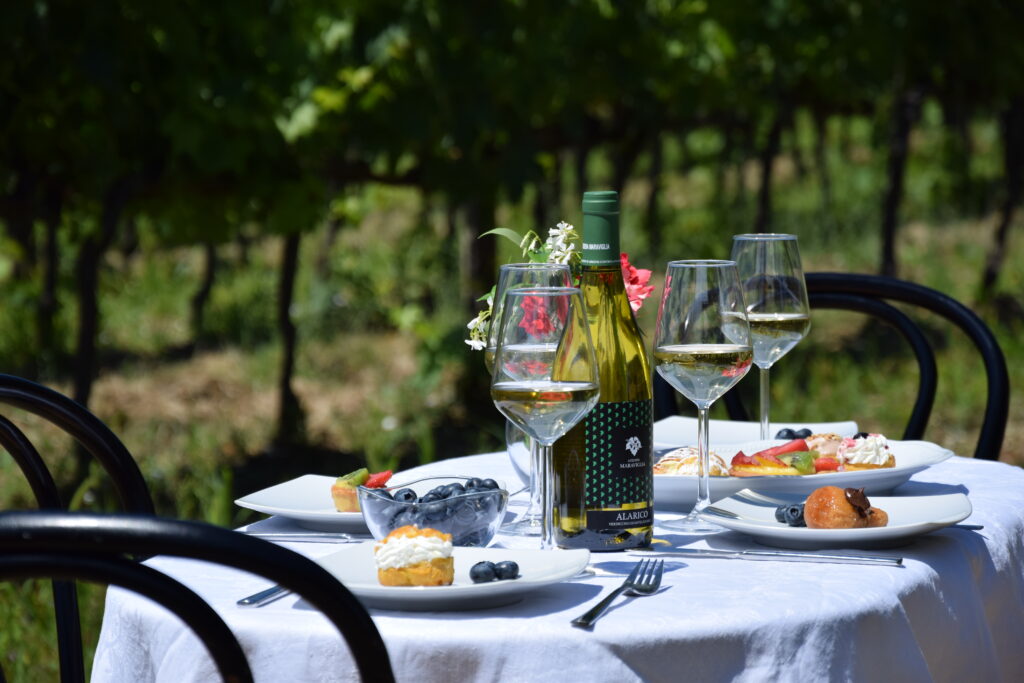 Verdicchio di Matelica Riserva bottle on a beautifully set table, perfect for sharing during a special meal.