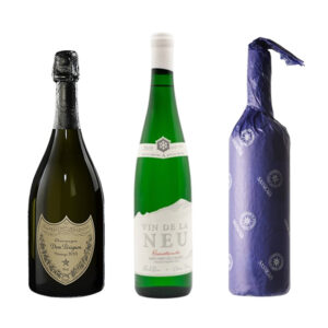 Dom Pérignon, Vin de la Neu and Sassicaia bottles side by side. Showcasing the Wine Legends Collection.
