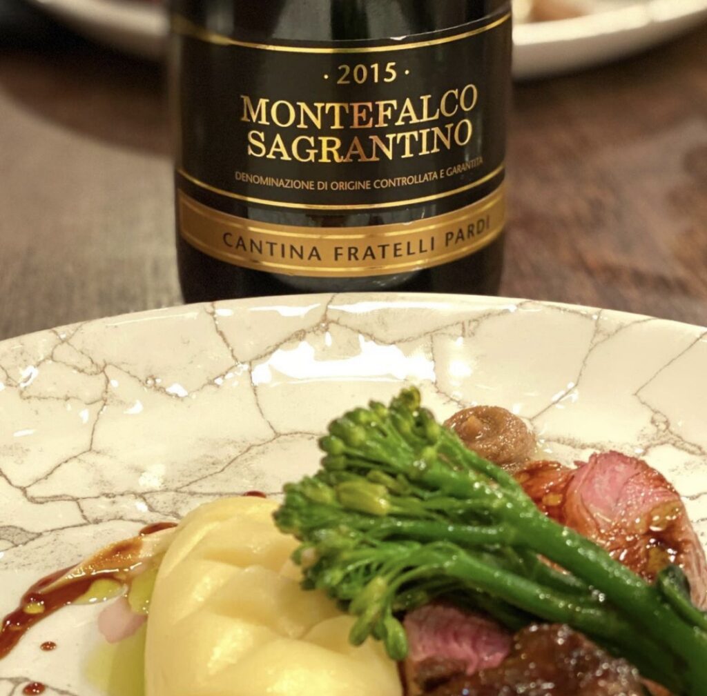 Montefalco Sagrantino di Pardi paired with a gourmet lamb dish, a perfect Italian wine pairing for Easter.